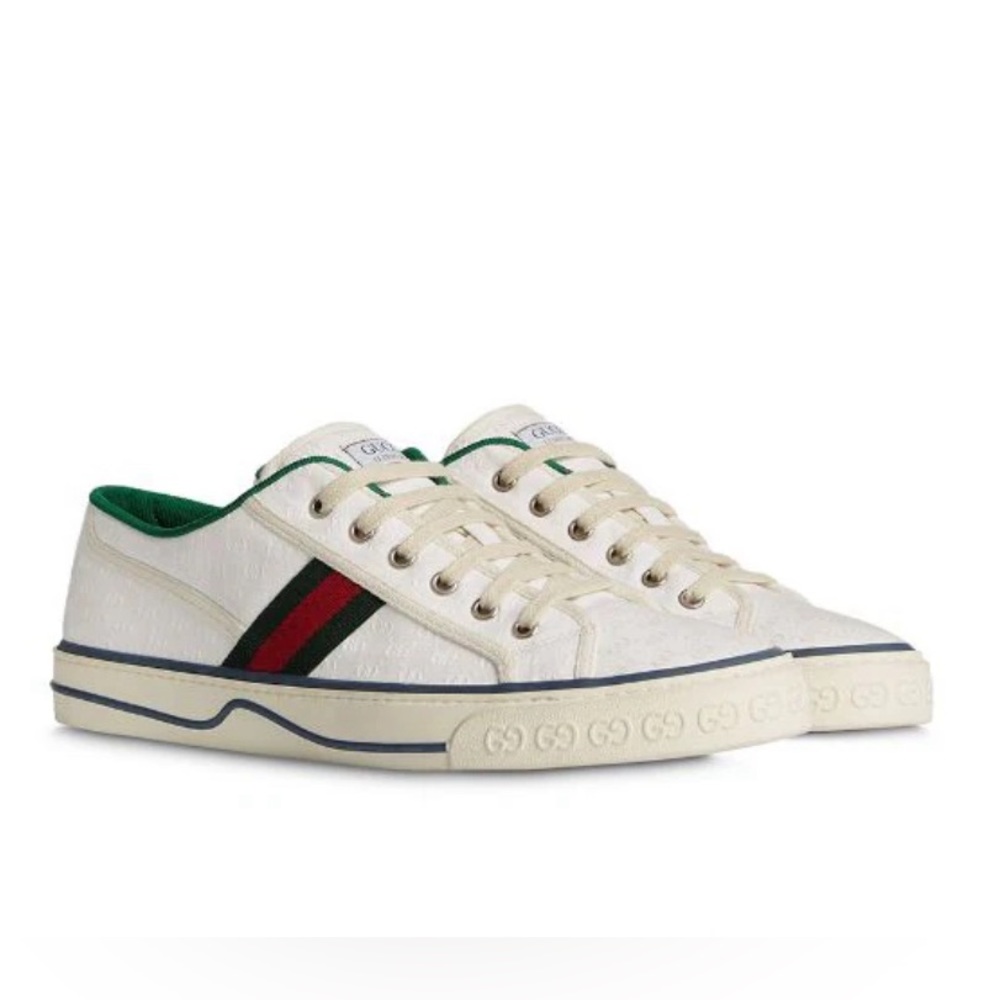 Classic white 1977 low top Gucci sneakers.